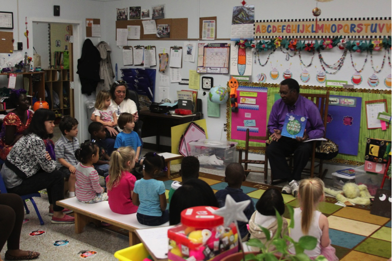 Dr. Moore reading and singing “Let There Be Peace on Earth” with 3-year-old friends at the Lipman School in Memphis on 2015 Peace Day. Photo courtesy Sandra Brown Turner.